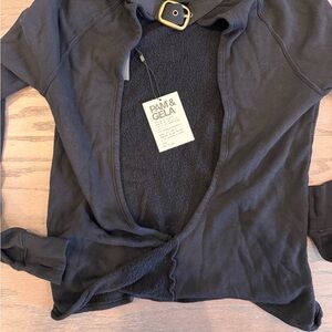 Pam & Gela Black Sweater with cut out back & gold buckle.